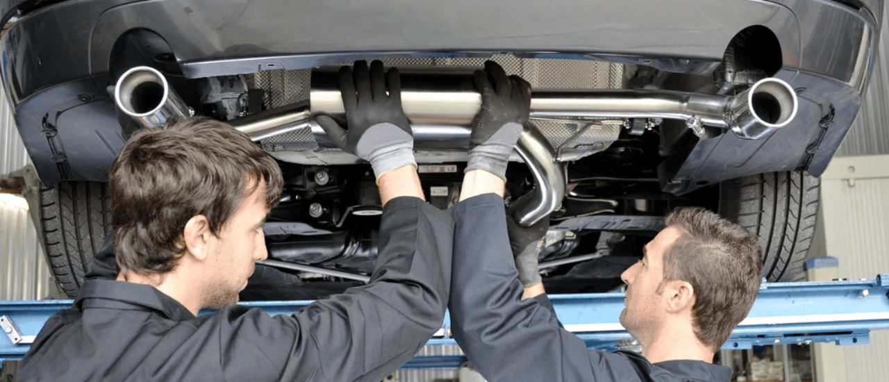 Mechanic inspecting a car’s exhaust system Brendale