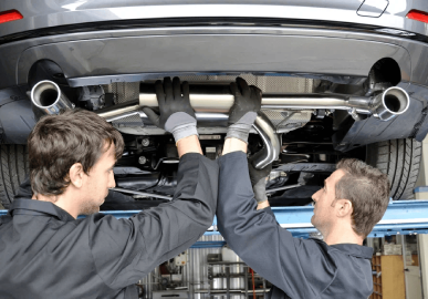 Mechanic inspecting a car’s exhaust system Brendale